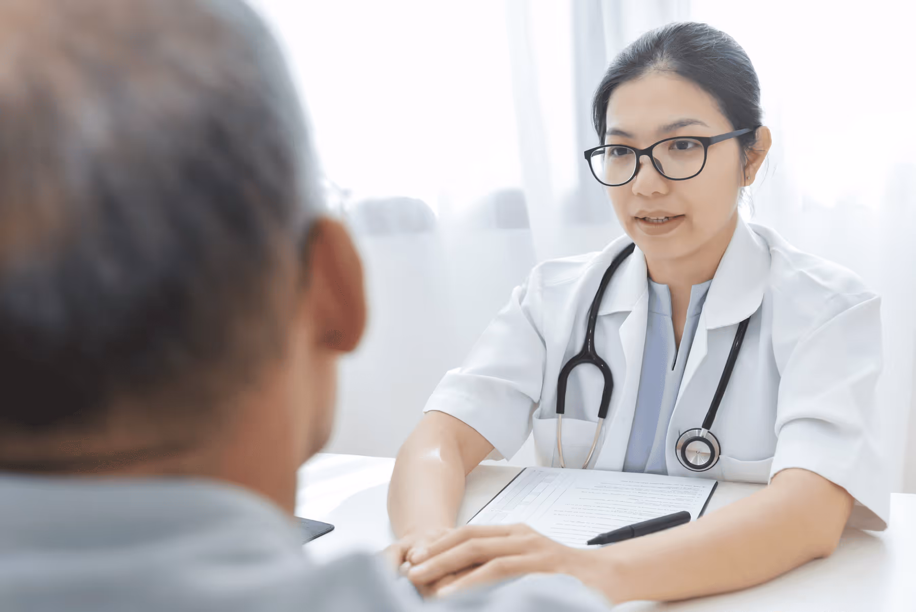 A man who is consulting a doctor for alopecia