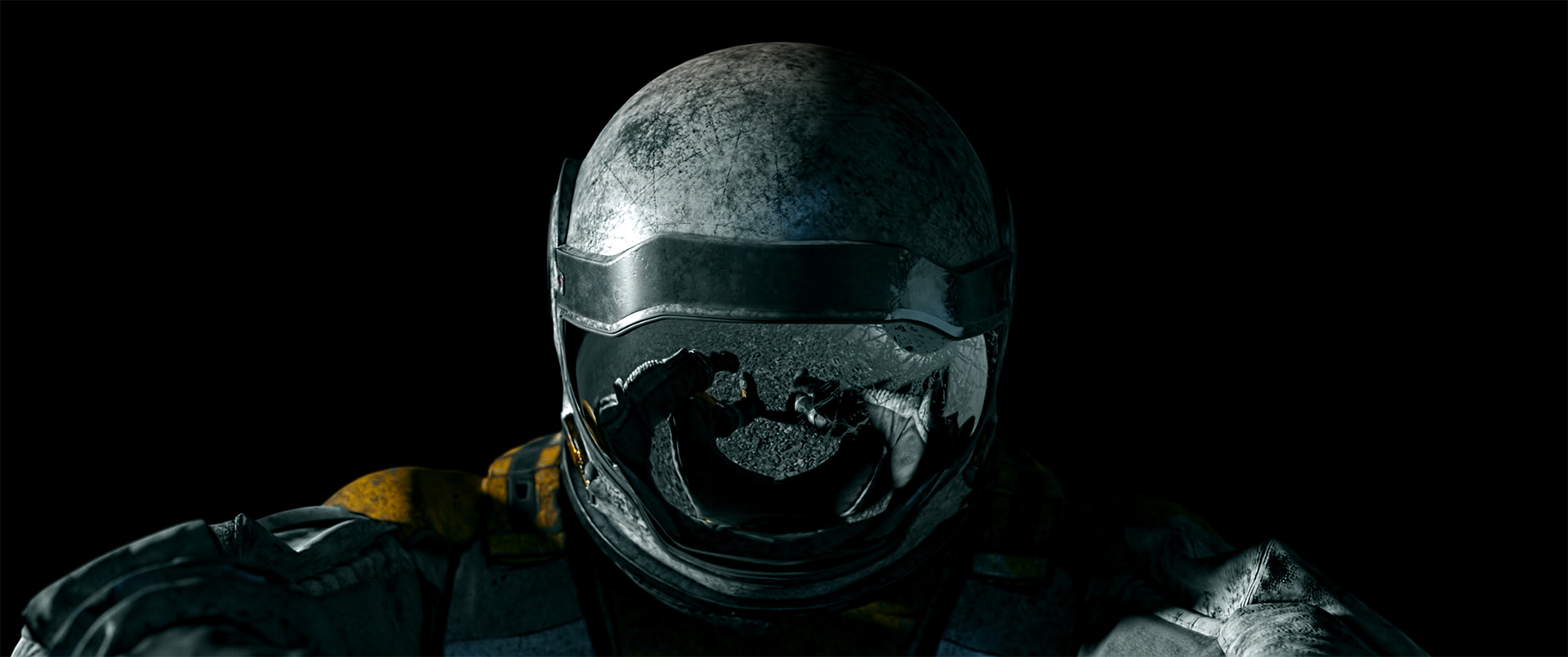 A close-up of a weathered astronaut helmet reflecting the astronaut's gloved hands and suit against a black background.