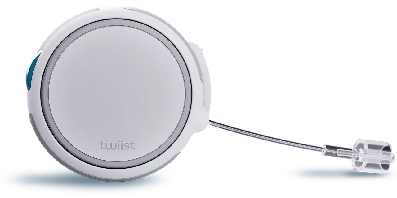 White circular device with a retractable cord and clear plastic end piece labeled 'twiist'.