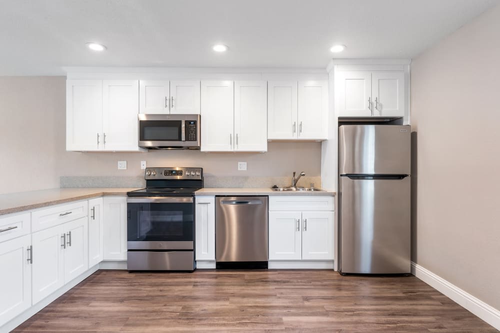 Kitchen with white cabinets and stainless steel appliances