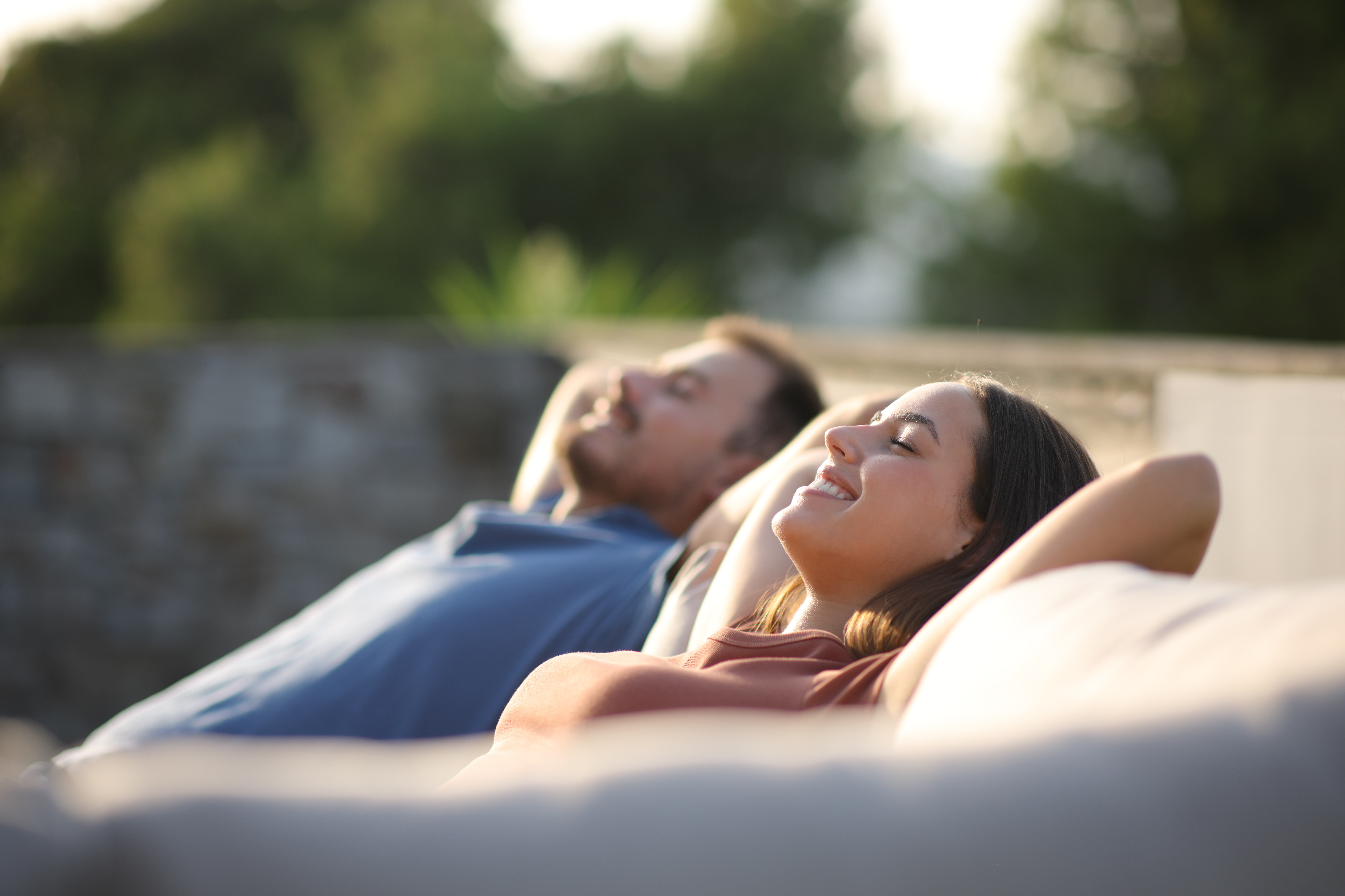 Couple relaxing outdoors stock image