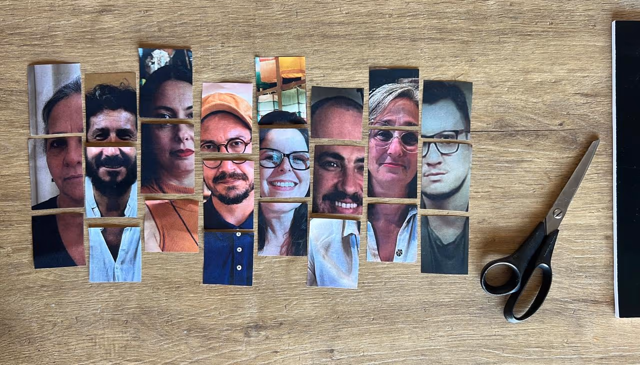 Recortes de fotos de rostos humanos cortados horizontalmente e alinhados lado a lado em uma mesa de madeira.