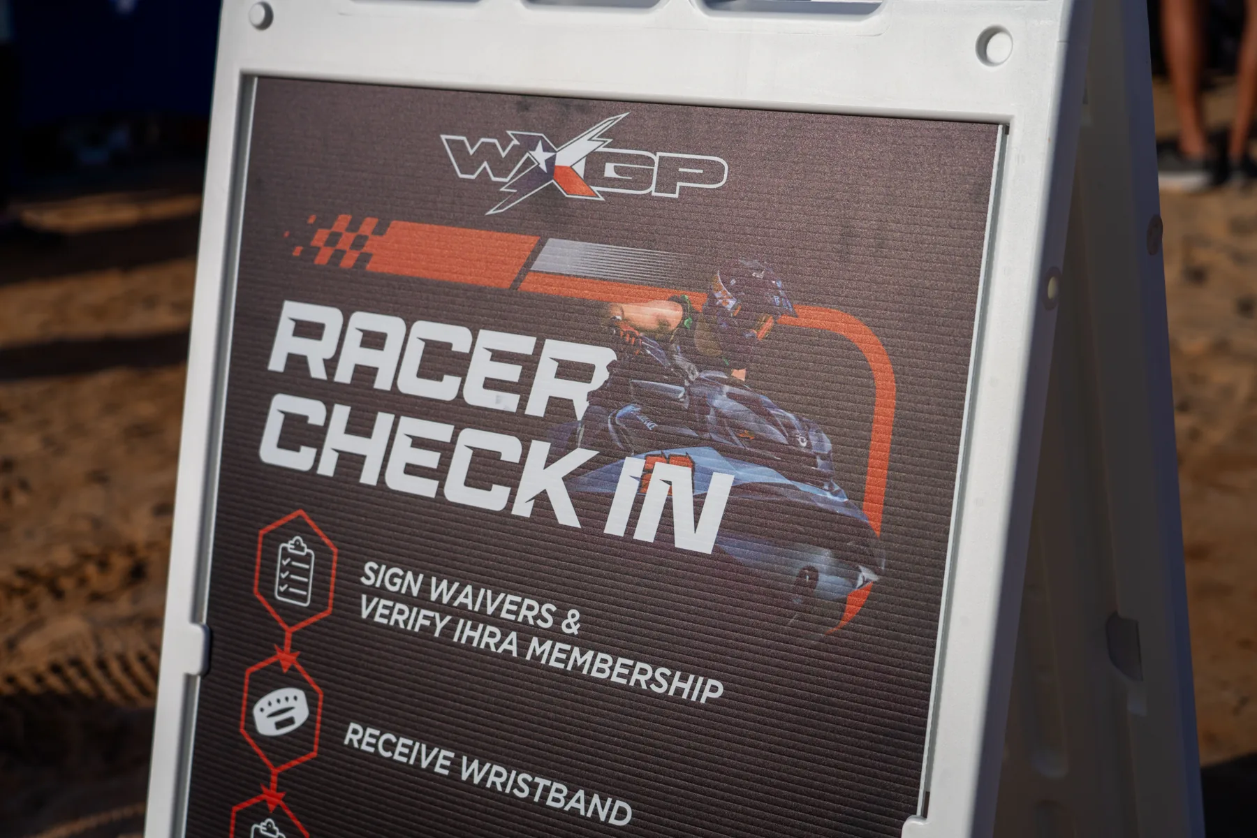 WXGP racer check-in A-frame sign with numbered steps