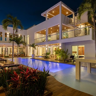 Villa Hurakán luxury villa exterior at night, Akumal Riviera Maya Mexico