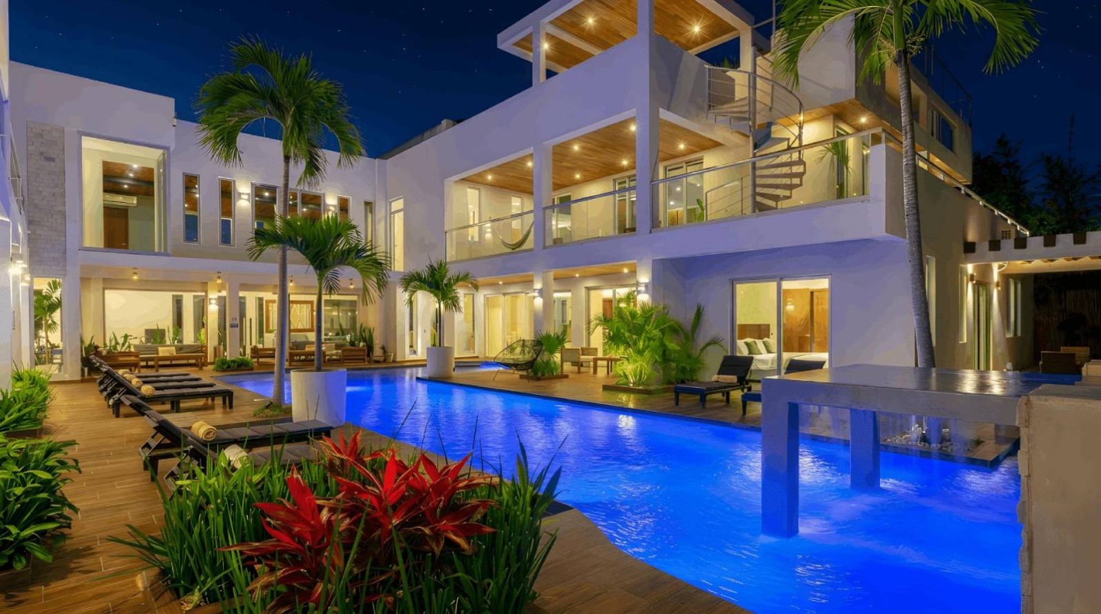 Indoor spa pool with waterfall feature at Villa Hurakán luxury villa