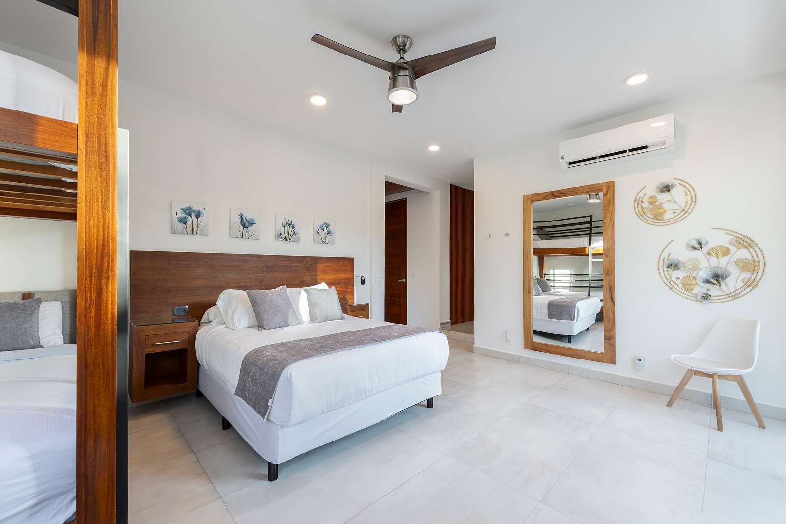 Modern luxury bedroom suite with wood accents at Villa Hurakán