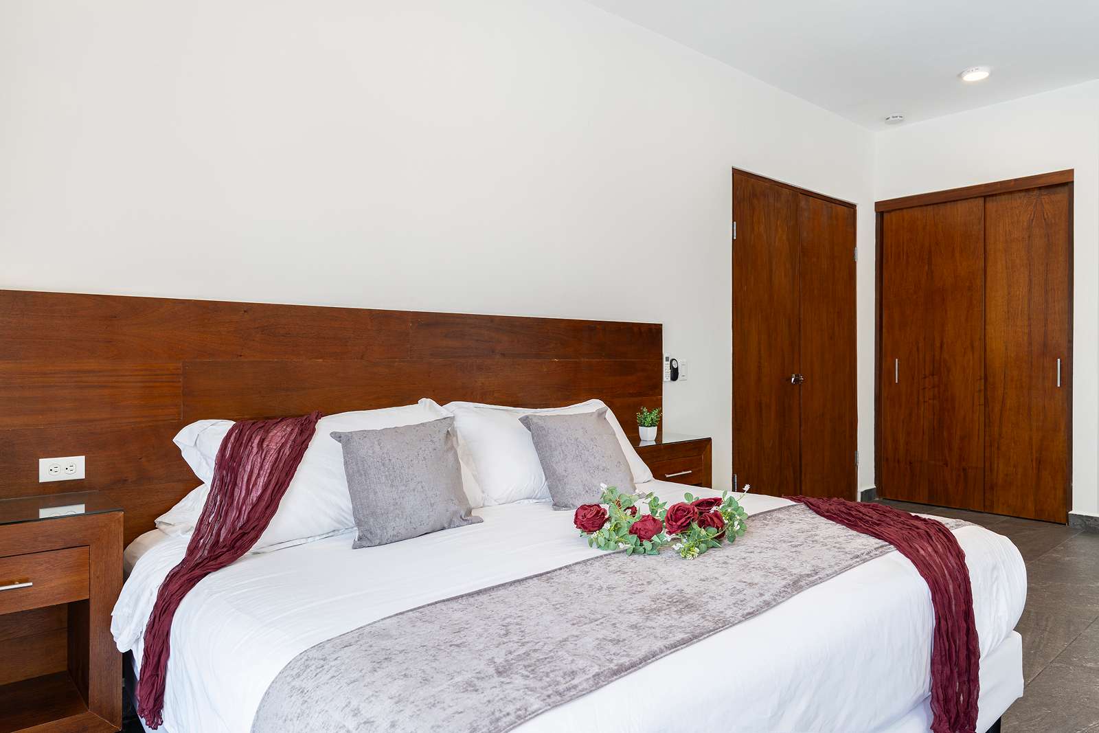 Elegant guest bedroom with floral welcome setup at Villa Hurakán