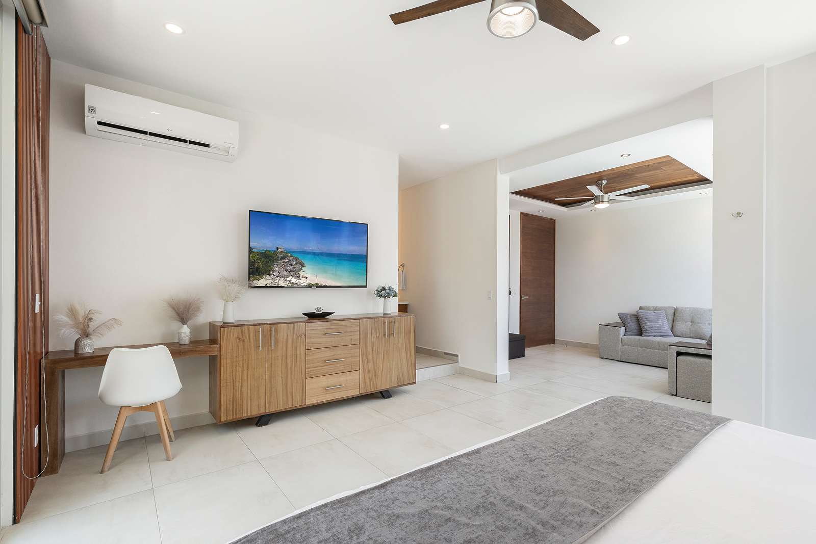 Luxury master suite with lounge area inside Villa Hurakán