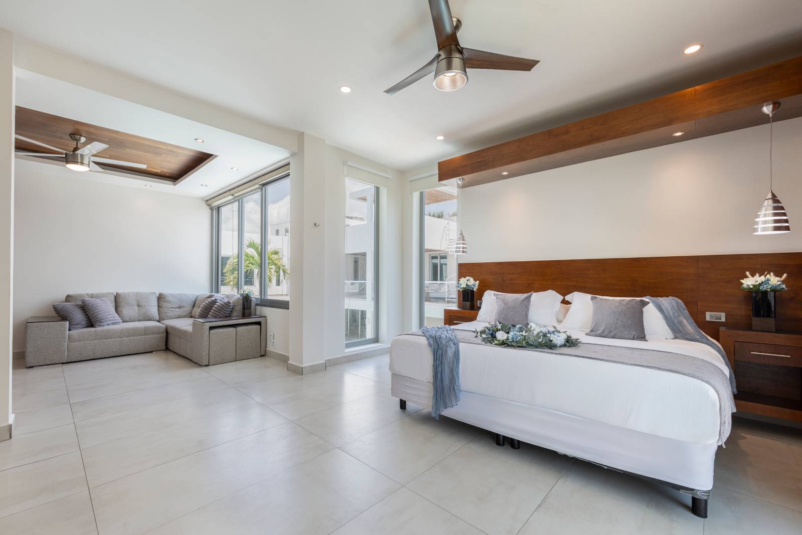 Spacious open-concept luxury bedroom suite at Villa Hurakán