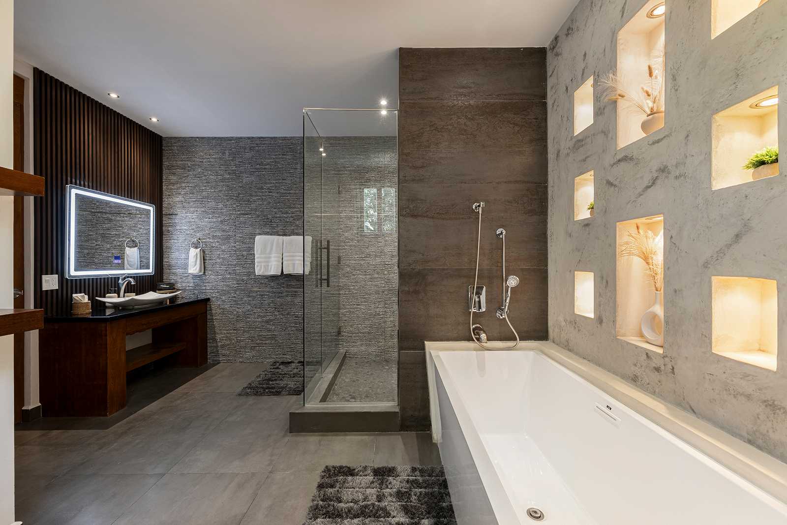 Luxury spa-style bathroom with soaking tub and walk-in shower at Villa Hurakán