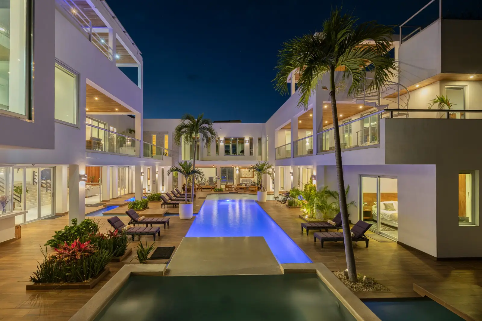 Elegant evening pool courtyard lighting at Villa Hurakán luxury estate