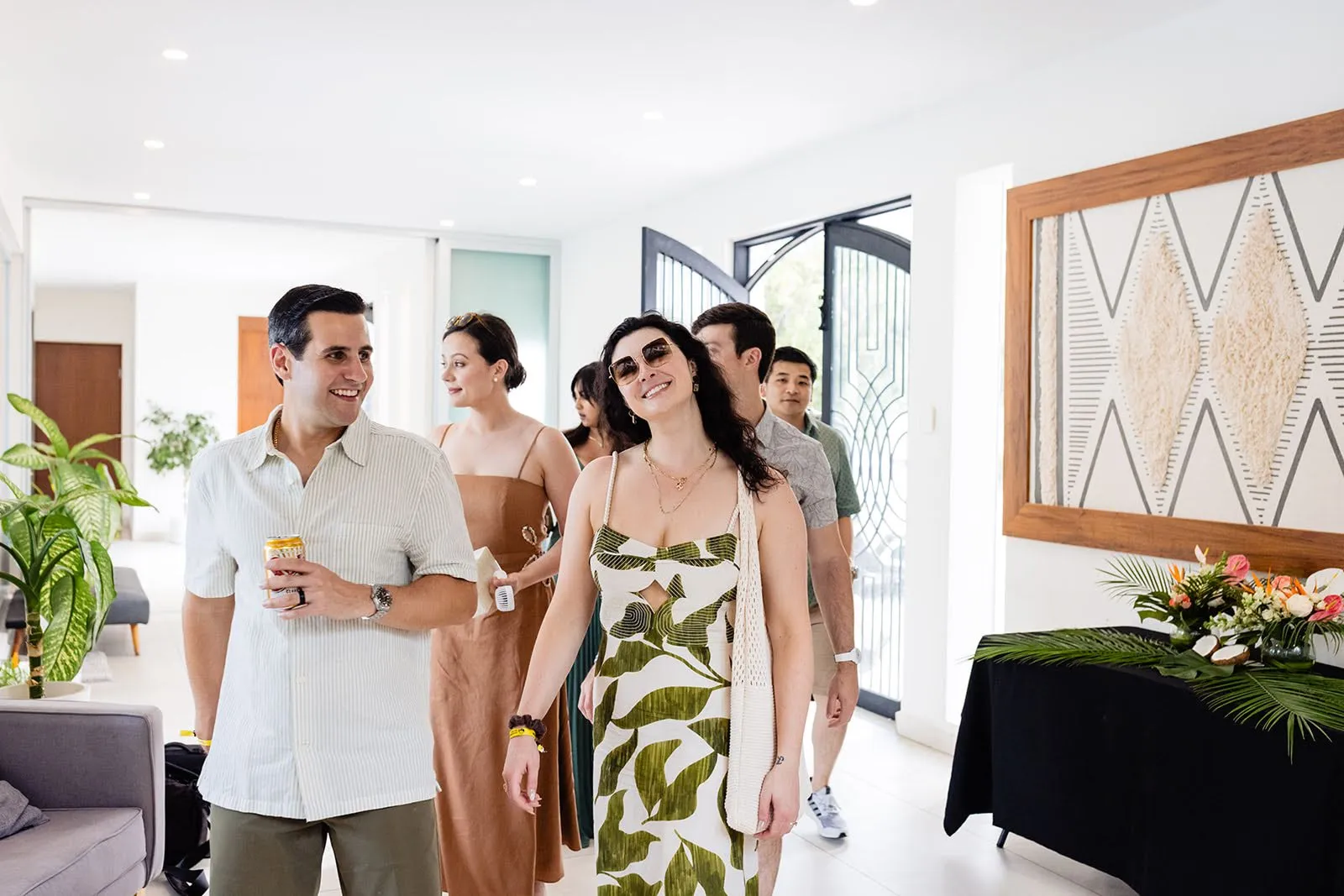 Guests arriving at a luxury wedding celebration inside Villa Hurakán