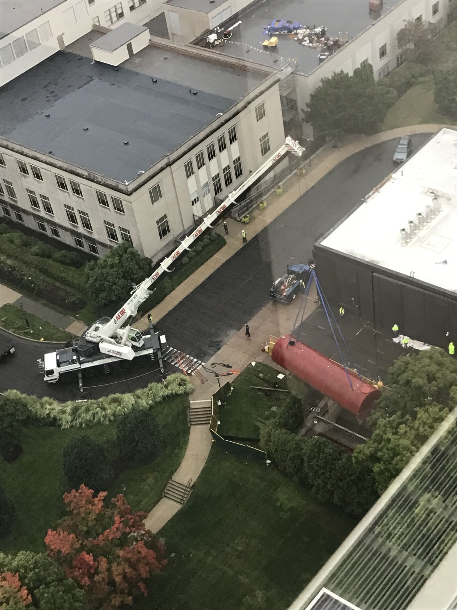 Aerial view of Aero Crane working a downtown high-rise project