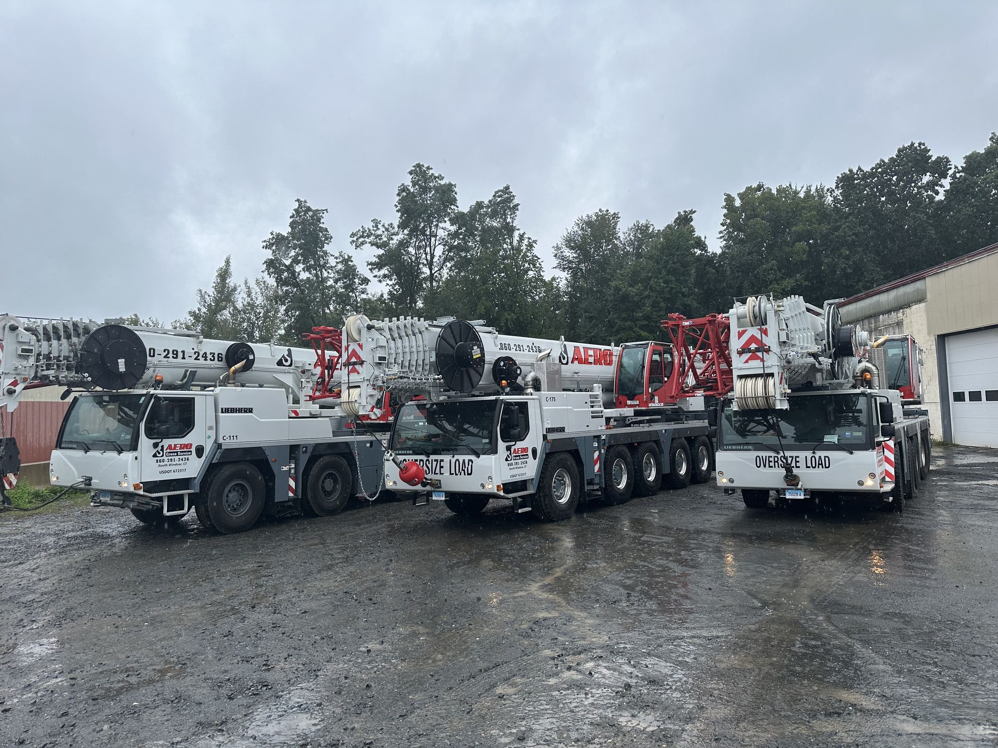 Three Aero Crane Service cranes lined up at the South Windsor yard