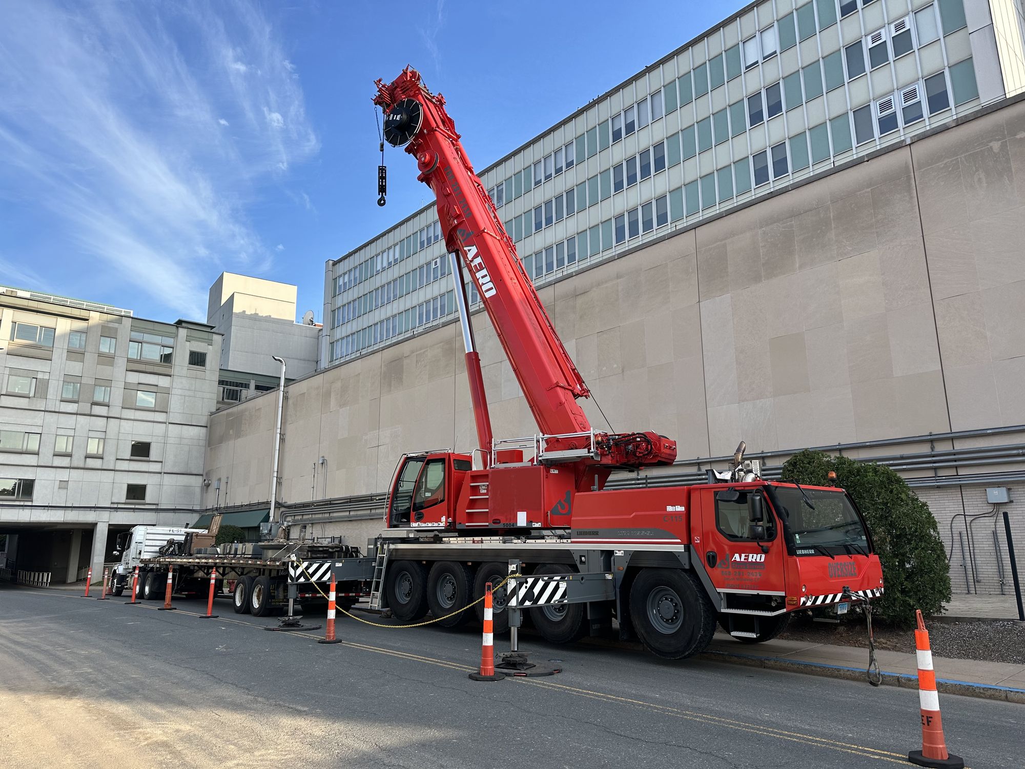 Red Aero crane set up at hospital construction project