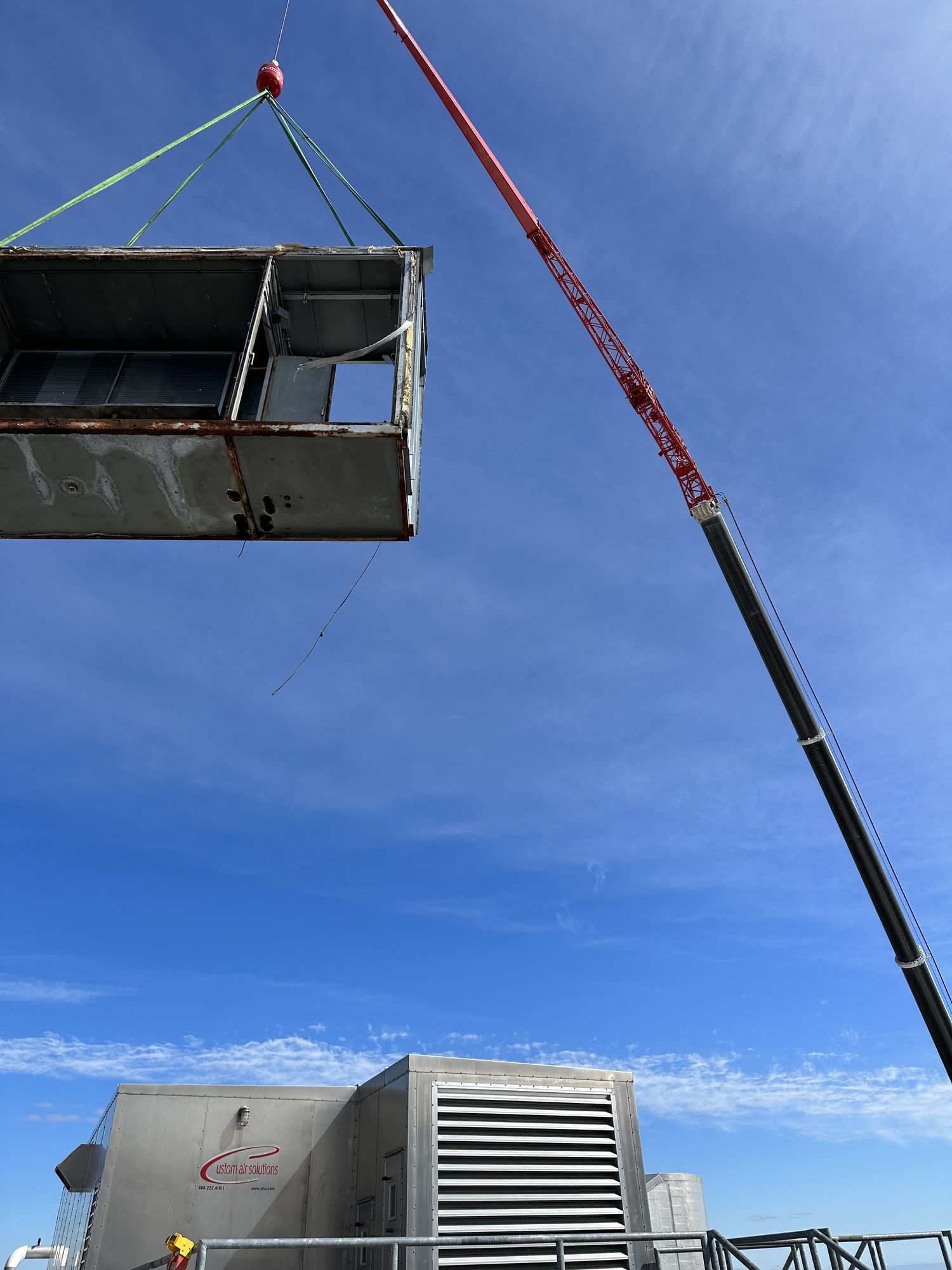 Aero Crane lifting HVAC unit to rooftop in Connecticut