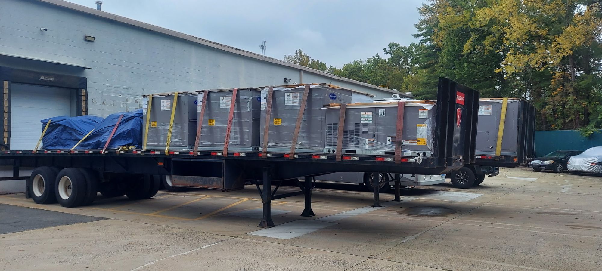 HVAC units secured on flatbed for transport by Aero Crane