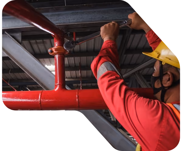a person installing a sprinkler system