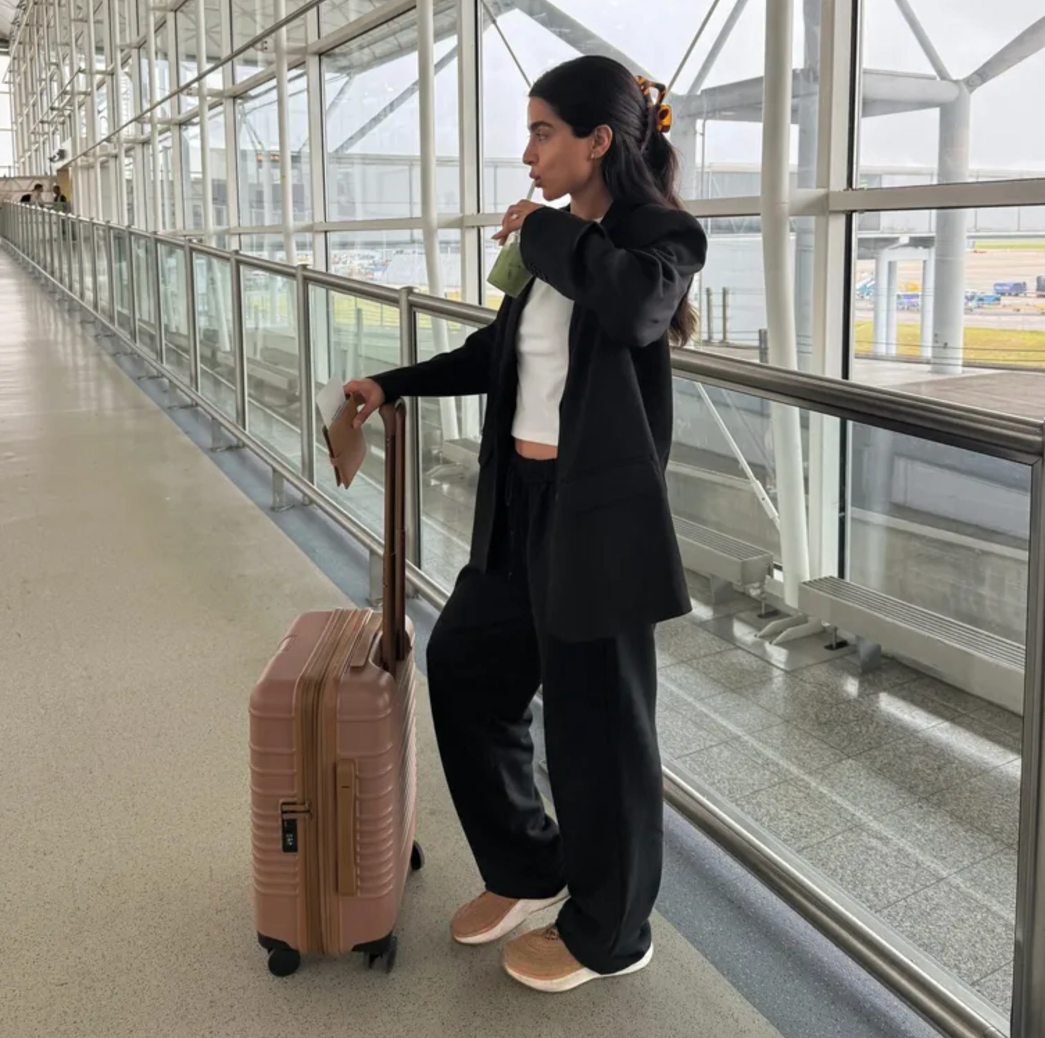 woman using BÉIS luggage
