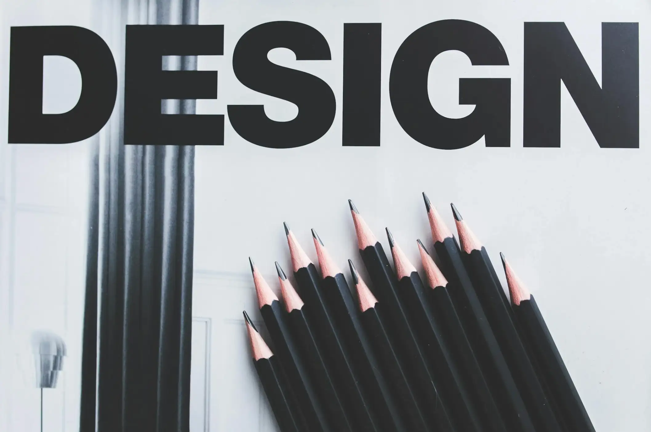 black pencils over design print