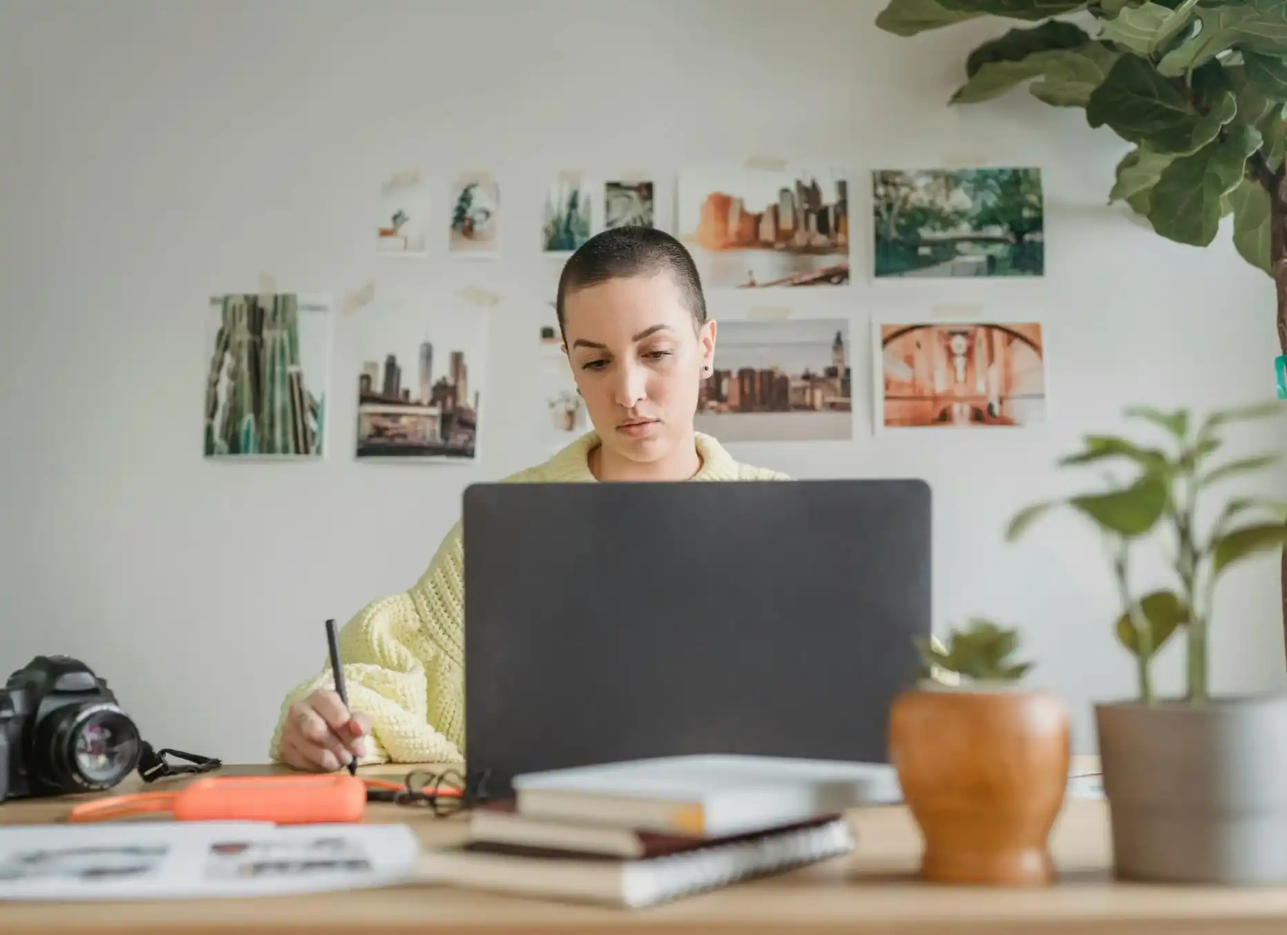 woman working on grey laptop
