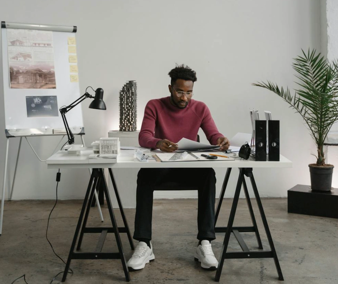 man looking at notes