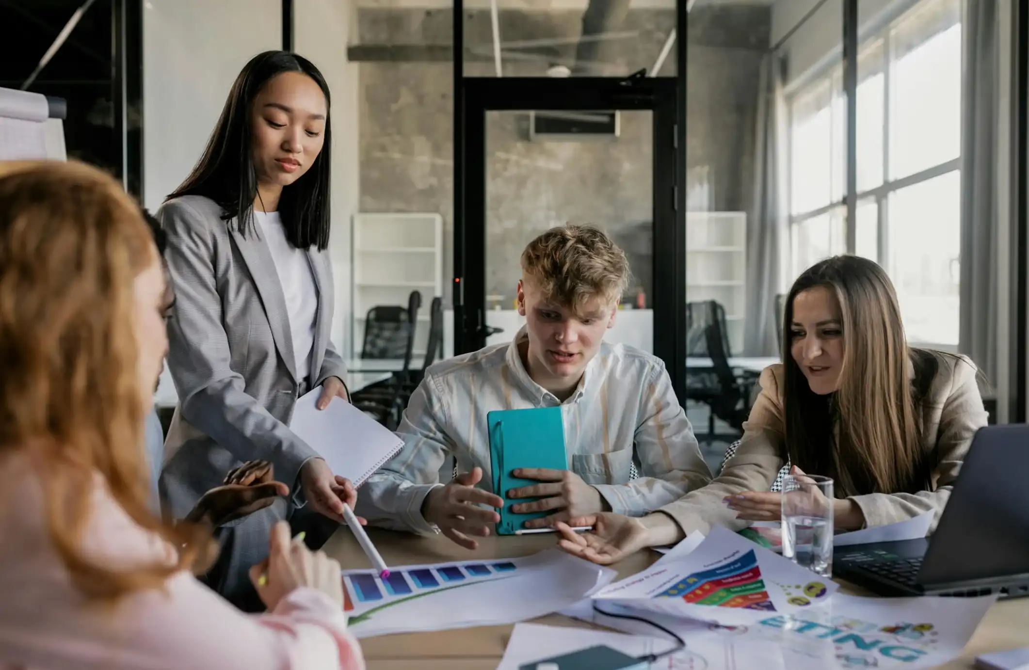 A Group of People Having a Meeting in the Office