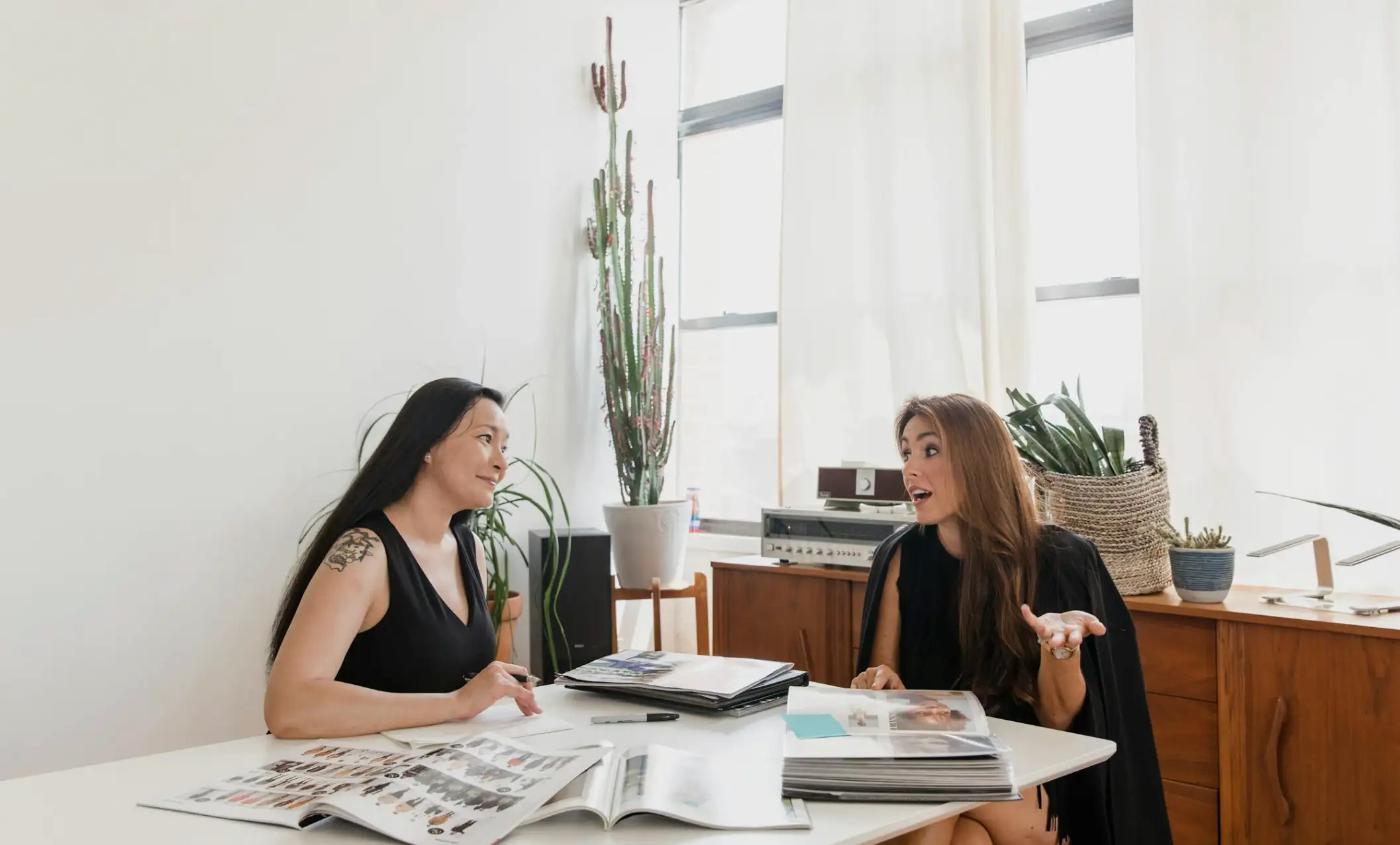 Businesswomen Talking while Sitting