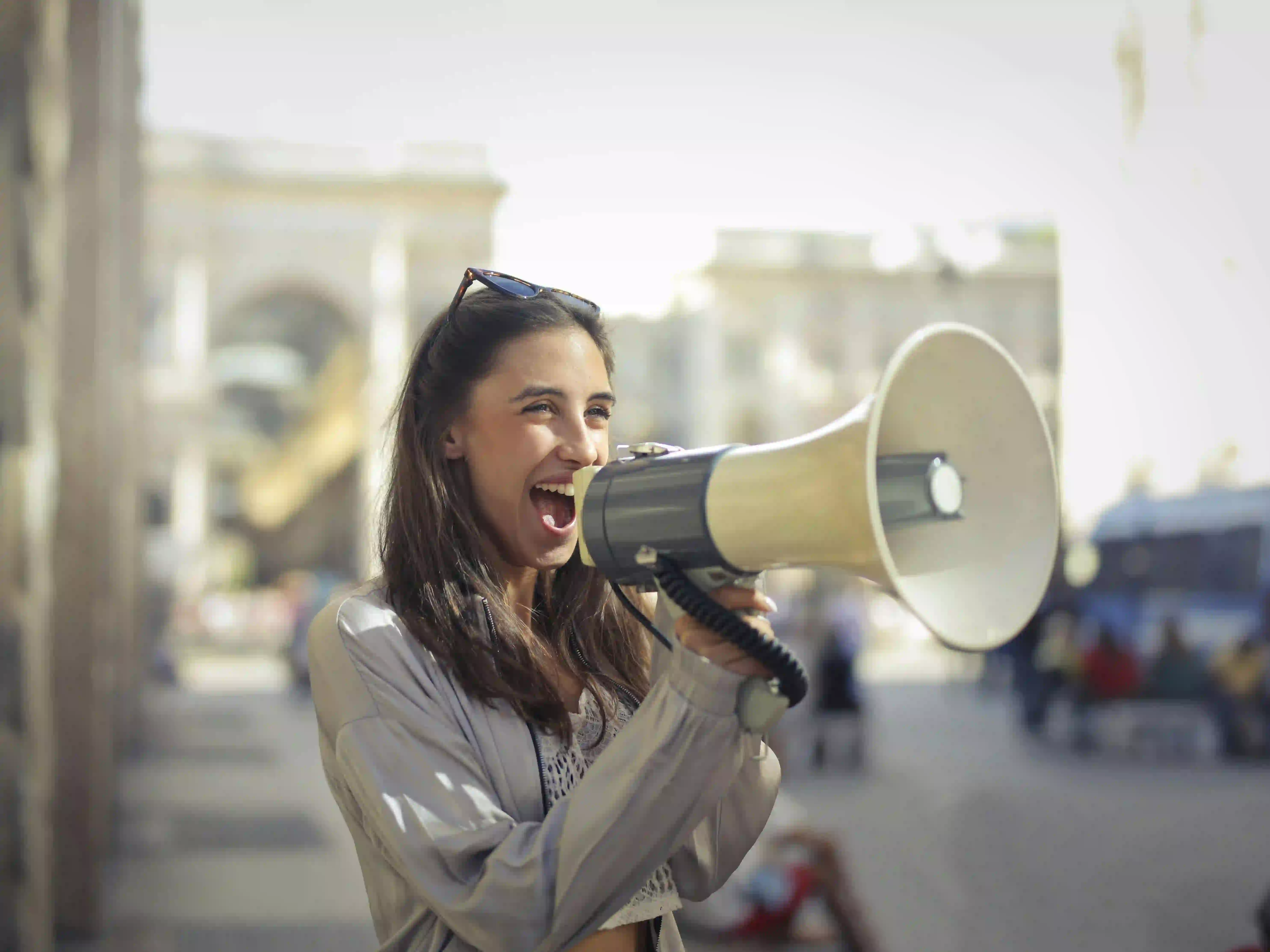 woman speaking into a microphone