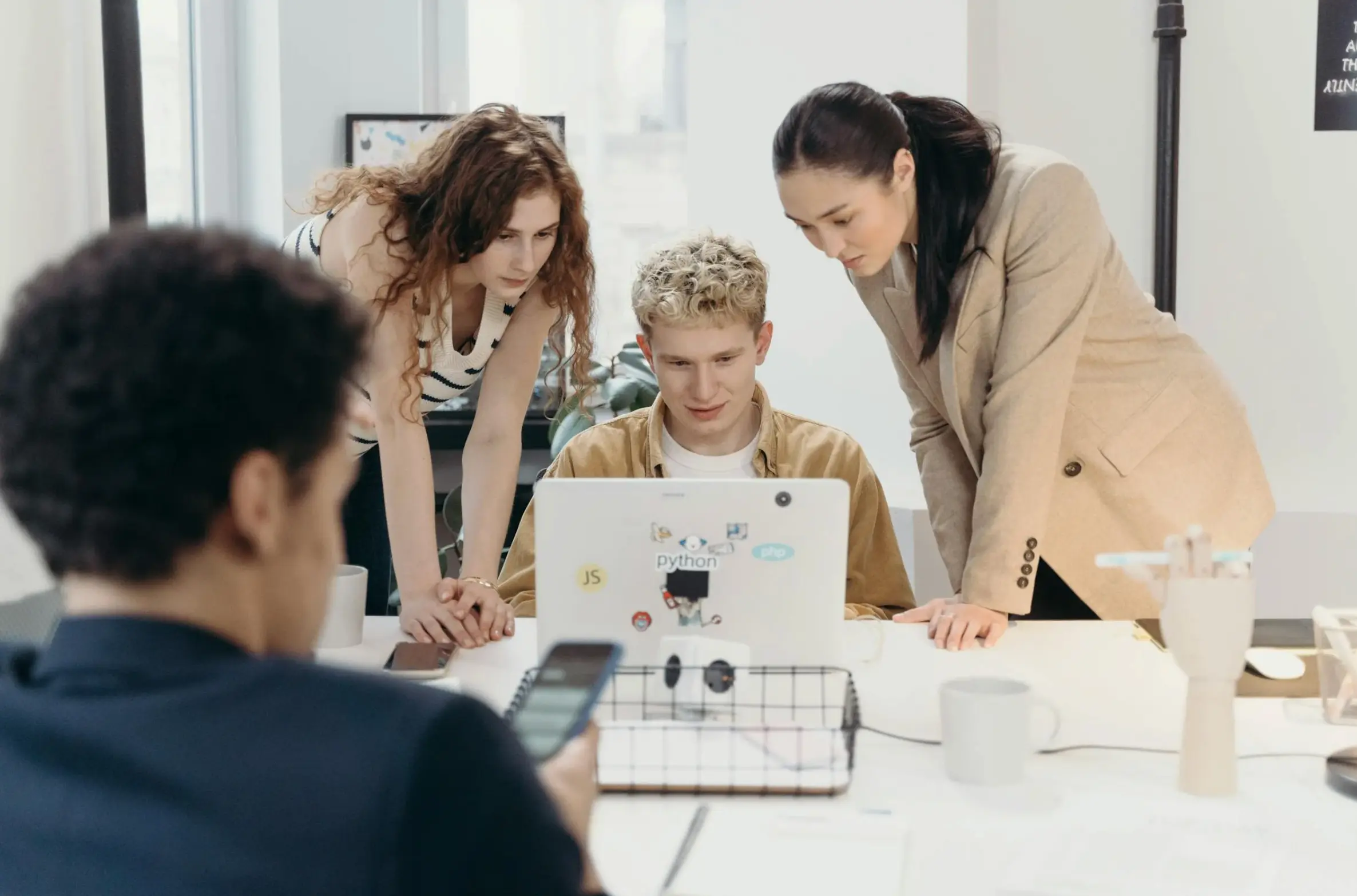 people looking at laptop
