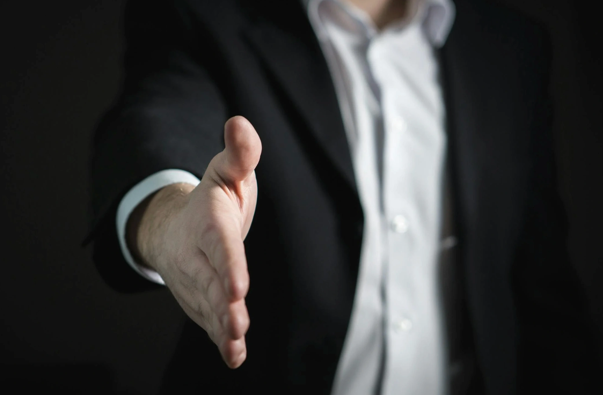 person reaching hand out