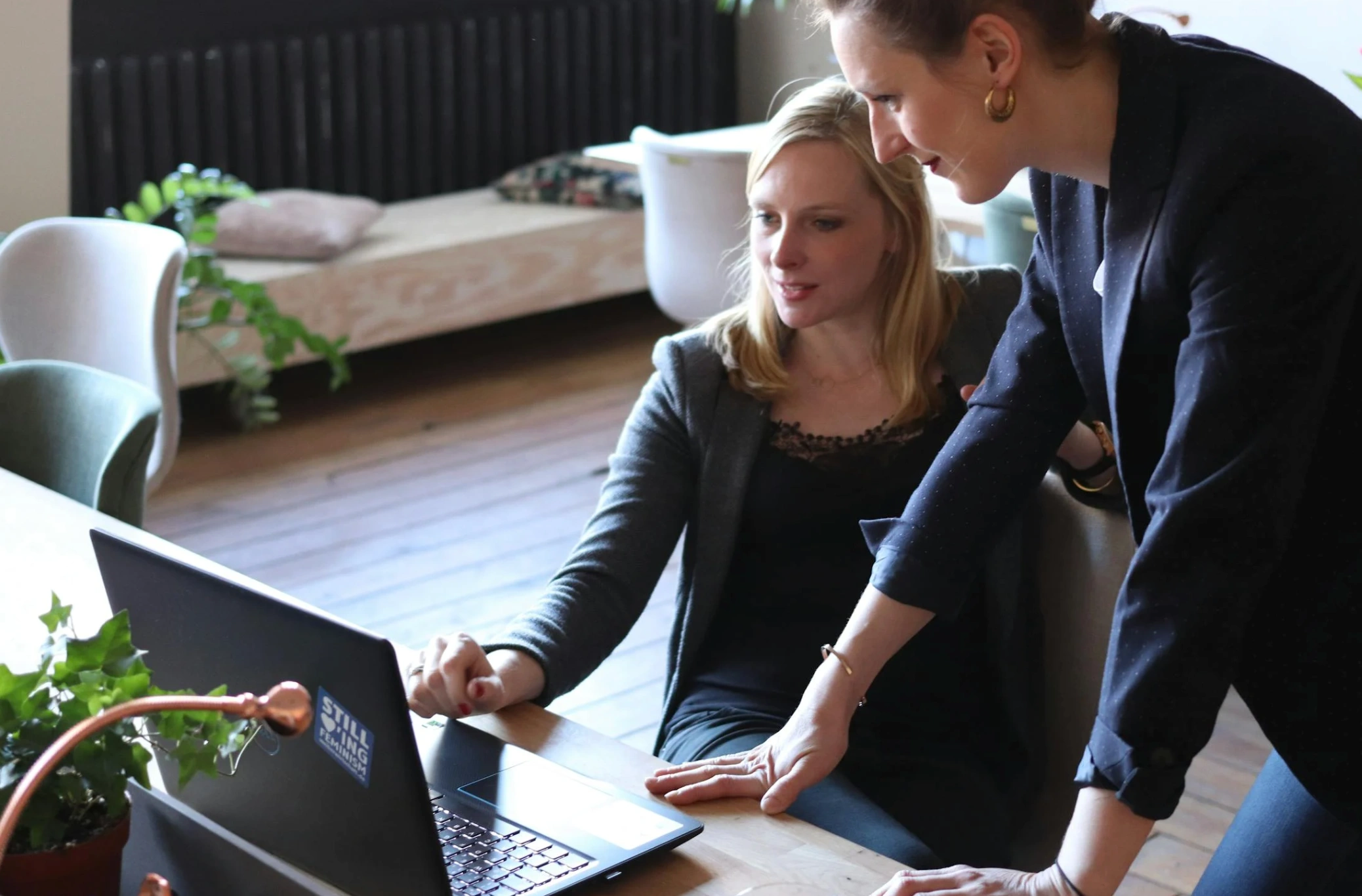 women collaborating on work together