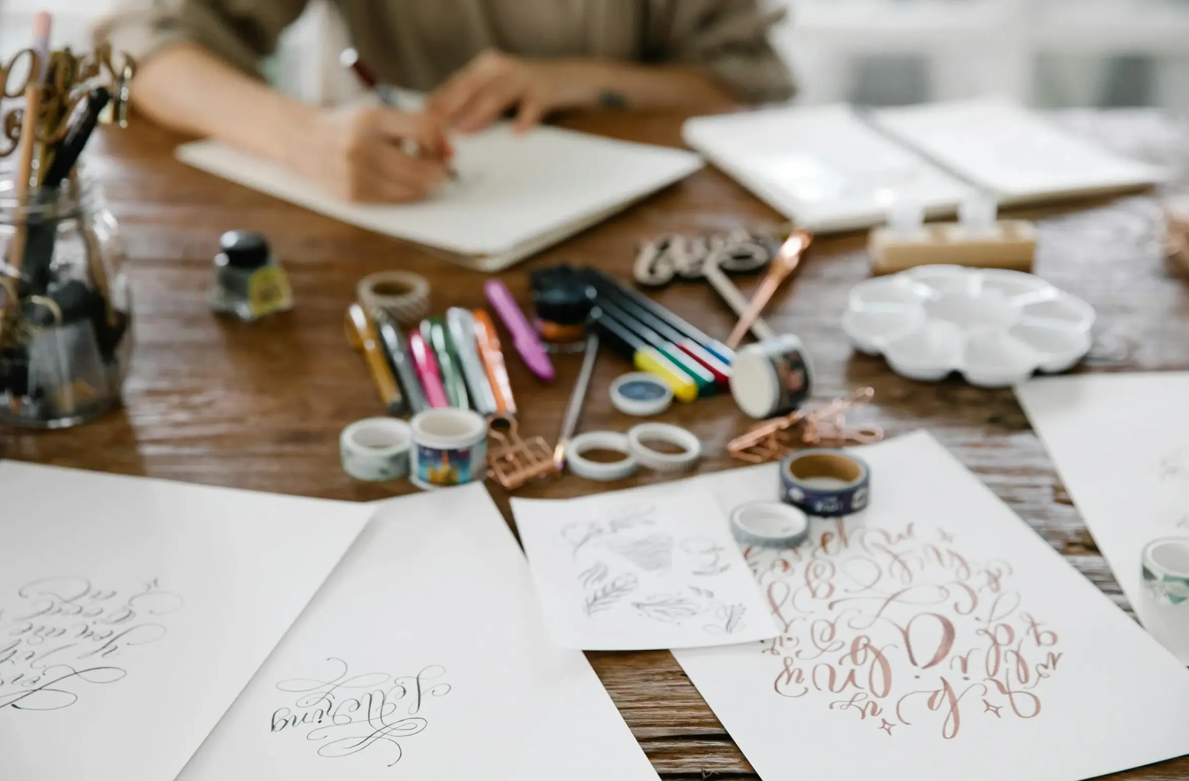 women drawing with utensil