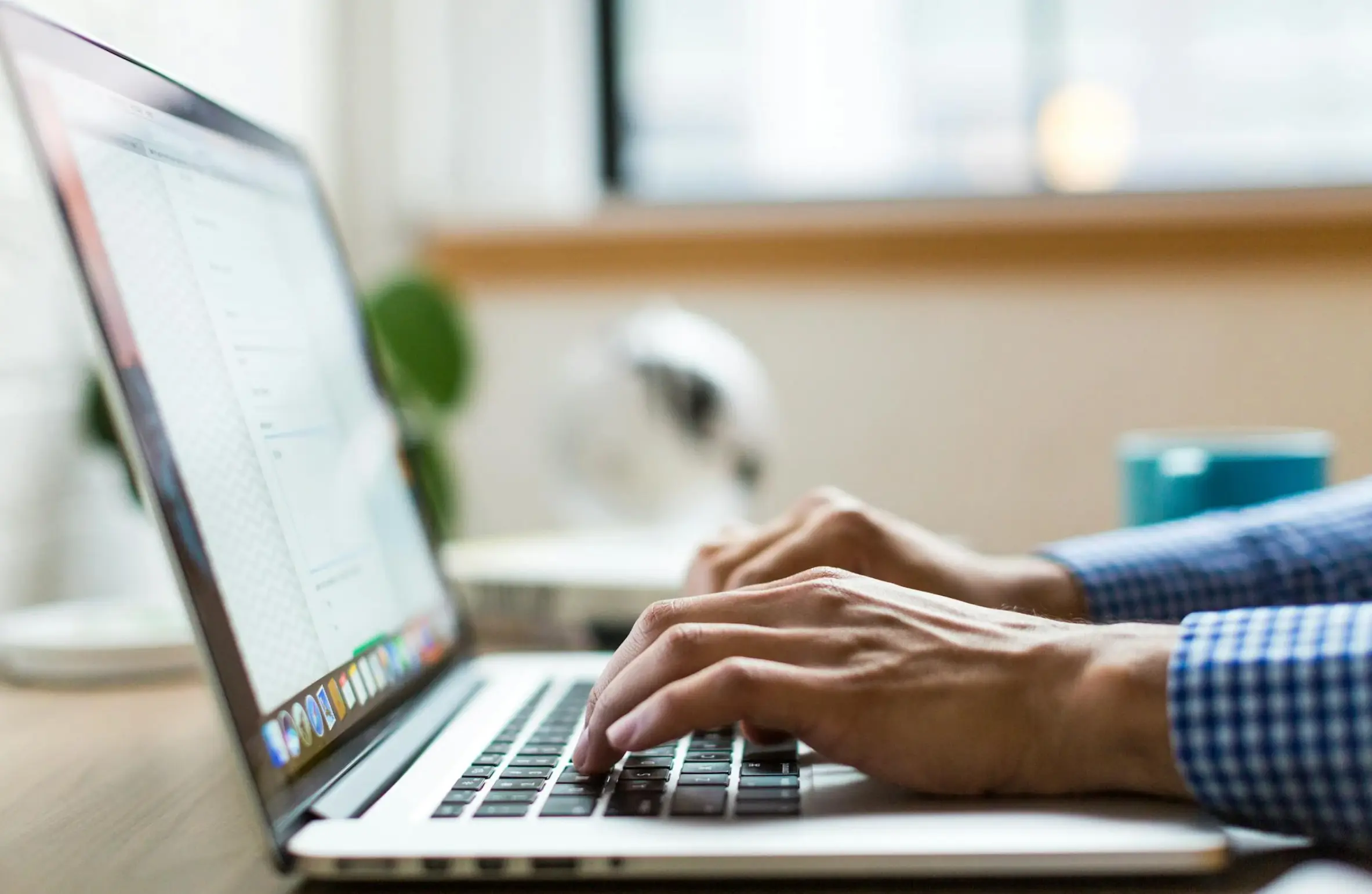 Marketer reviewing Google Search Console keyword ranking data on a laptop