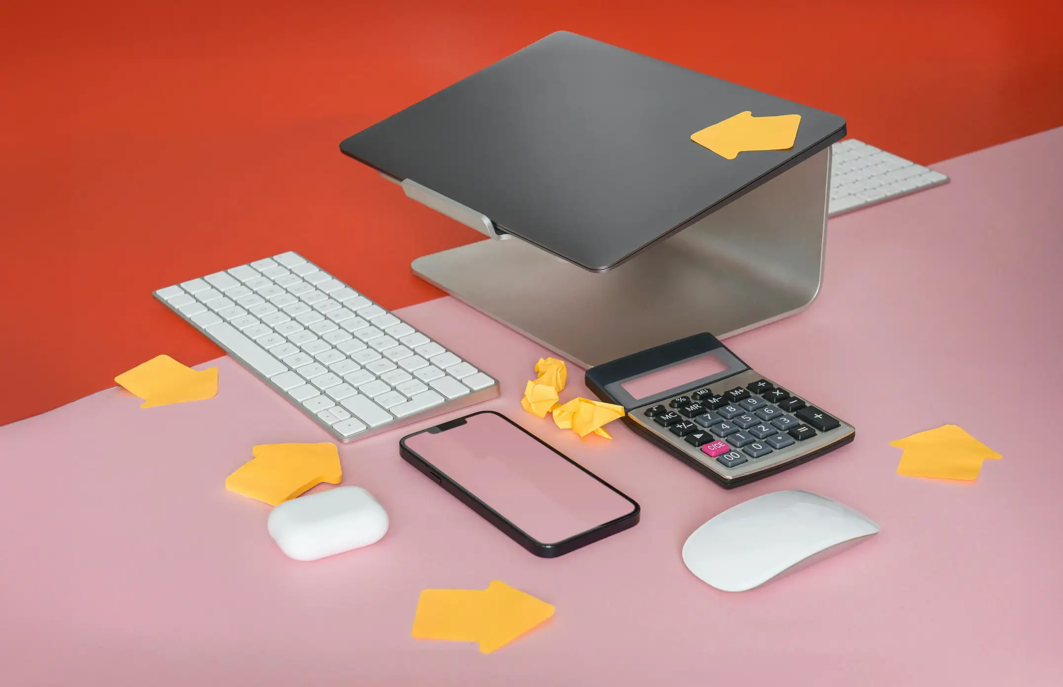 a laptop and other devices laying on background