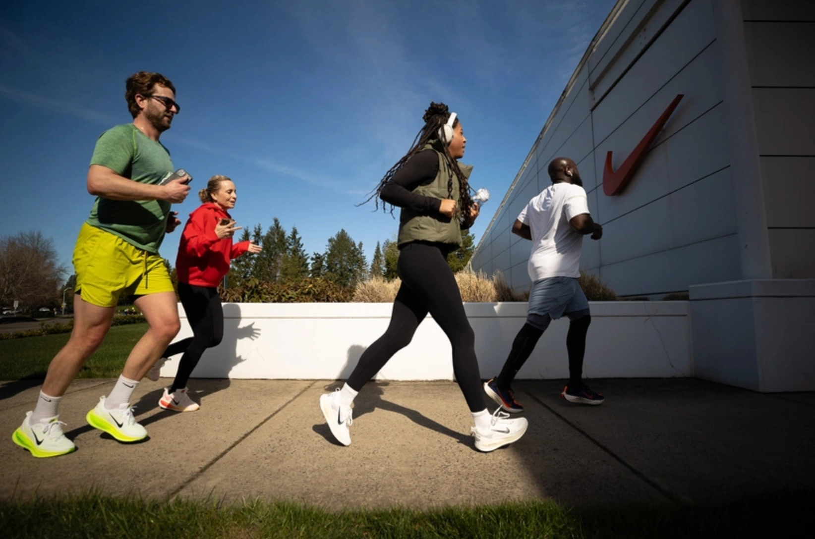 People running towards Nike store