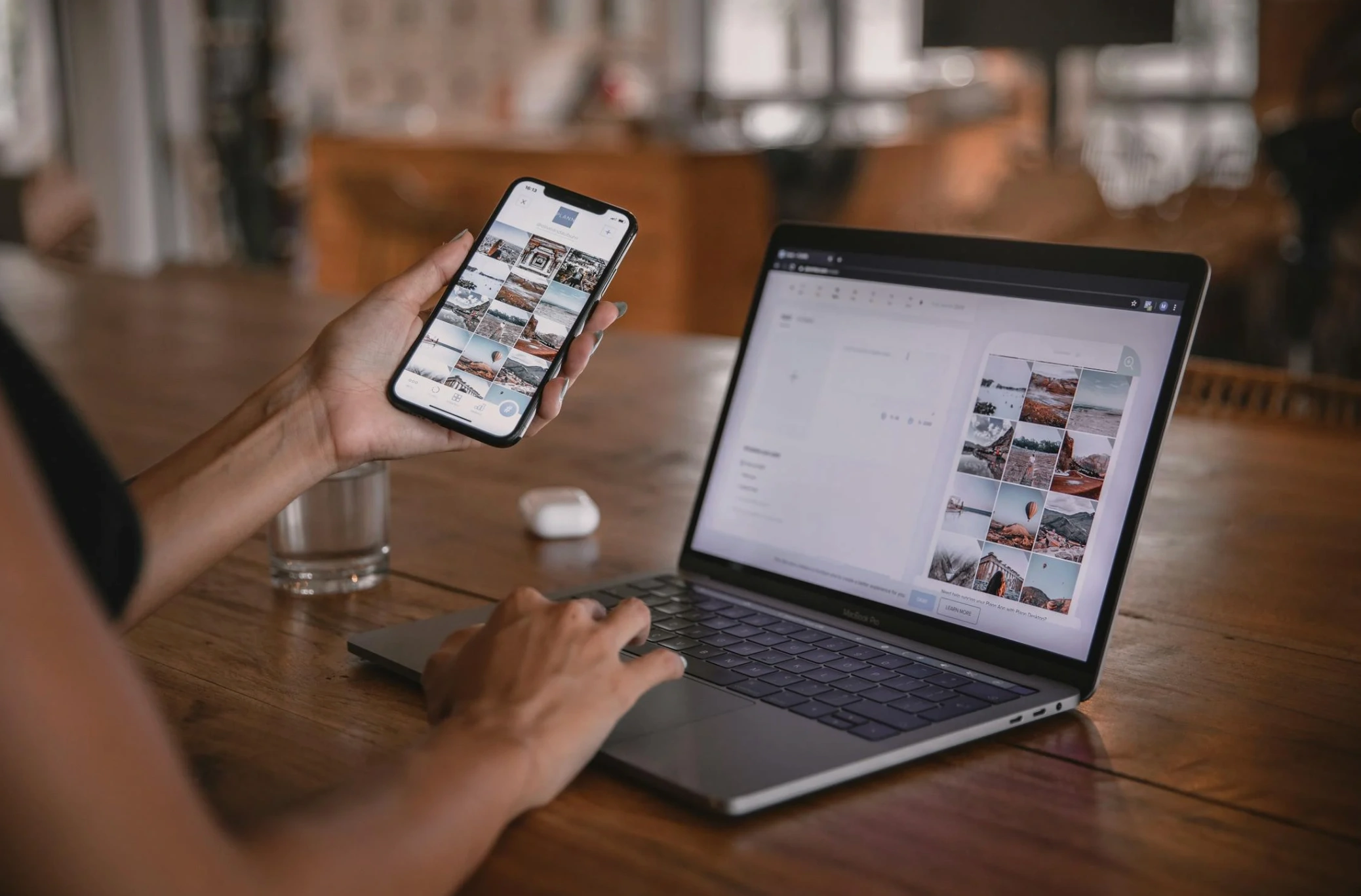 woman looking at posts on two devices