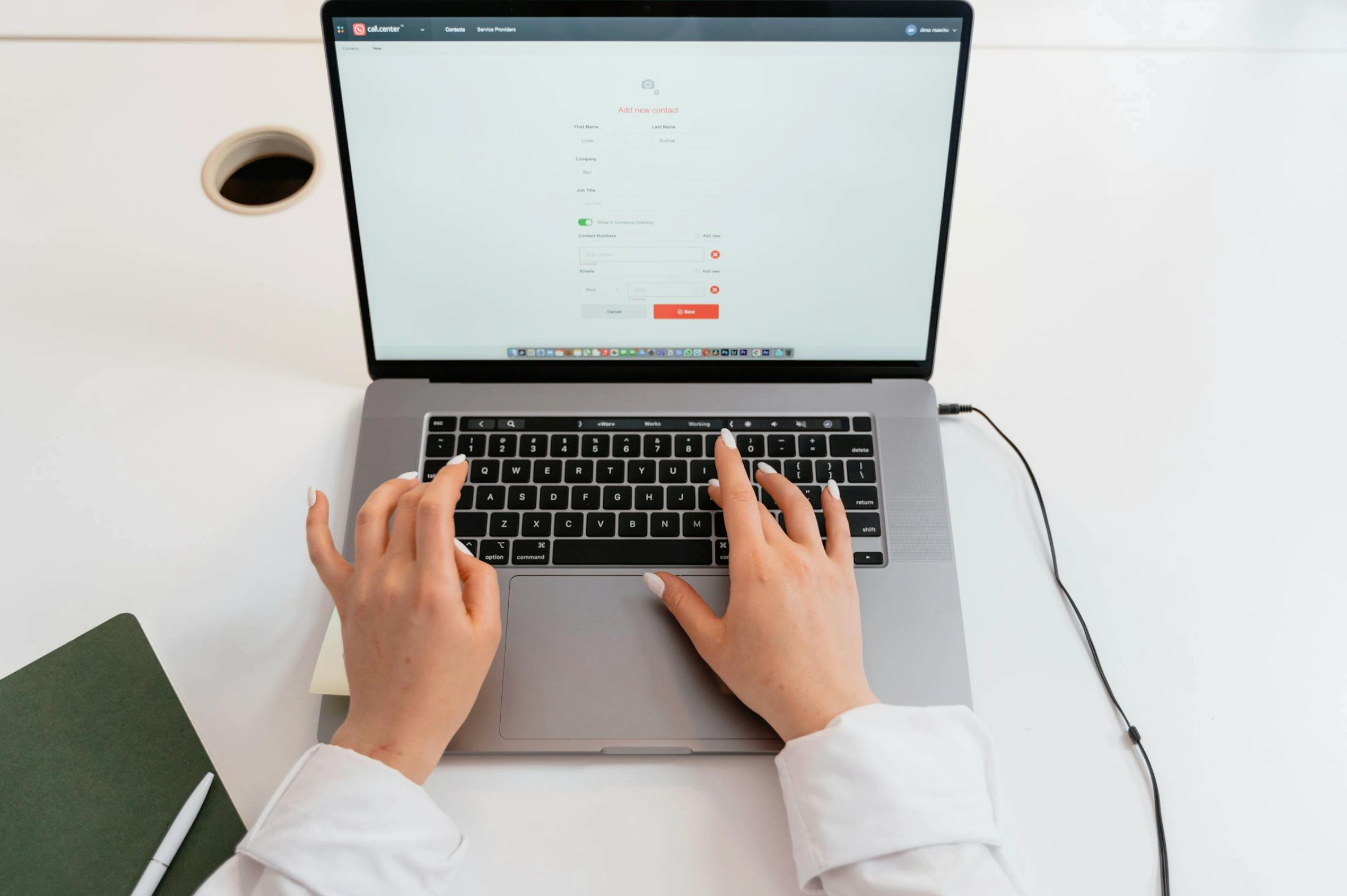 person typing on laptop