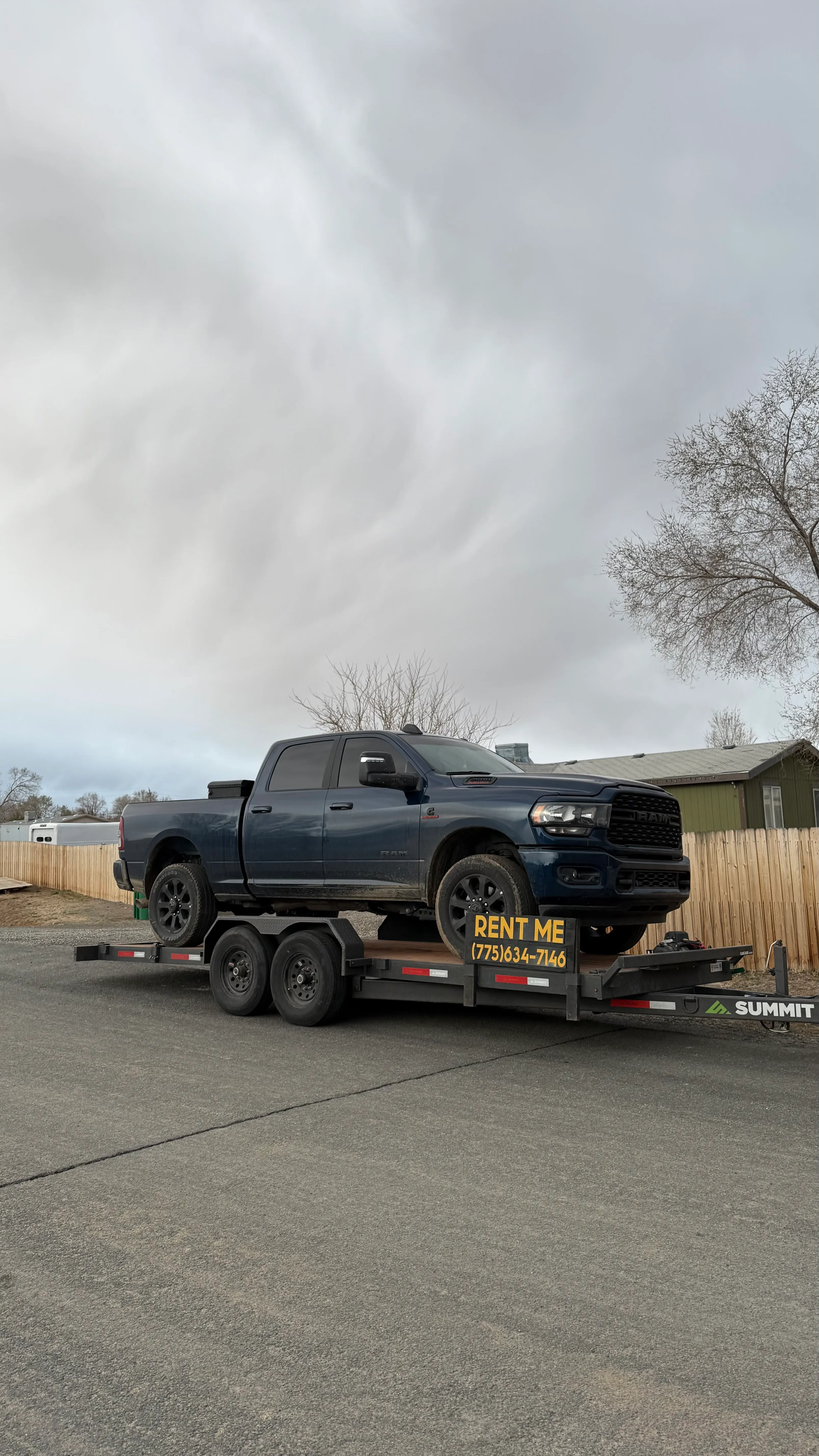Pickup truck on an OTG trailer with a Rent Me sign