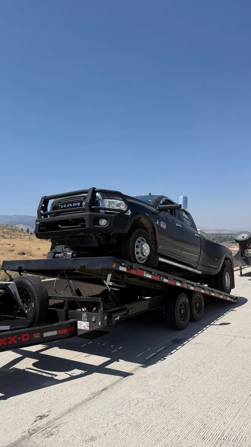Black Ram 3500 dually on the OTG deckover tilt trailer