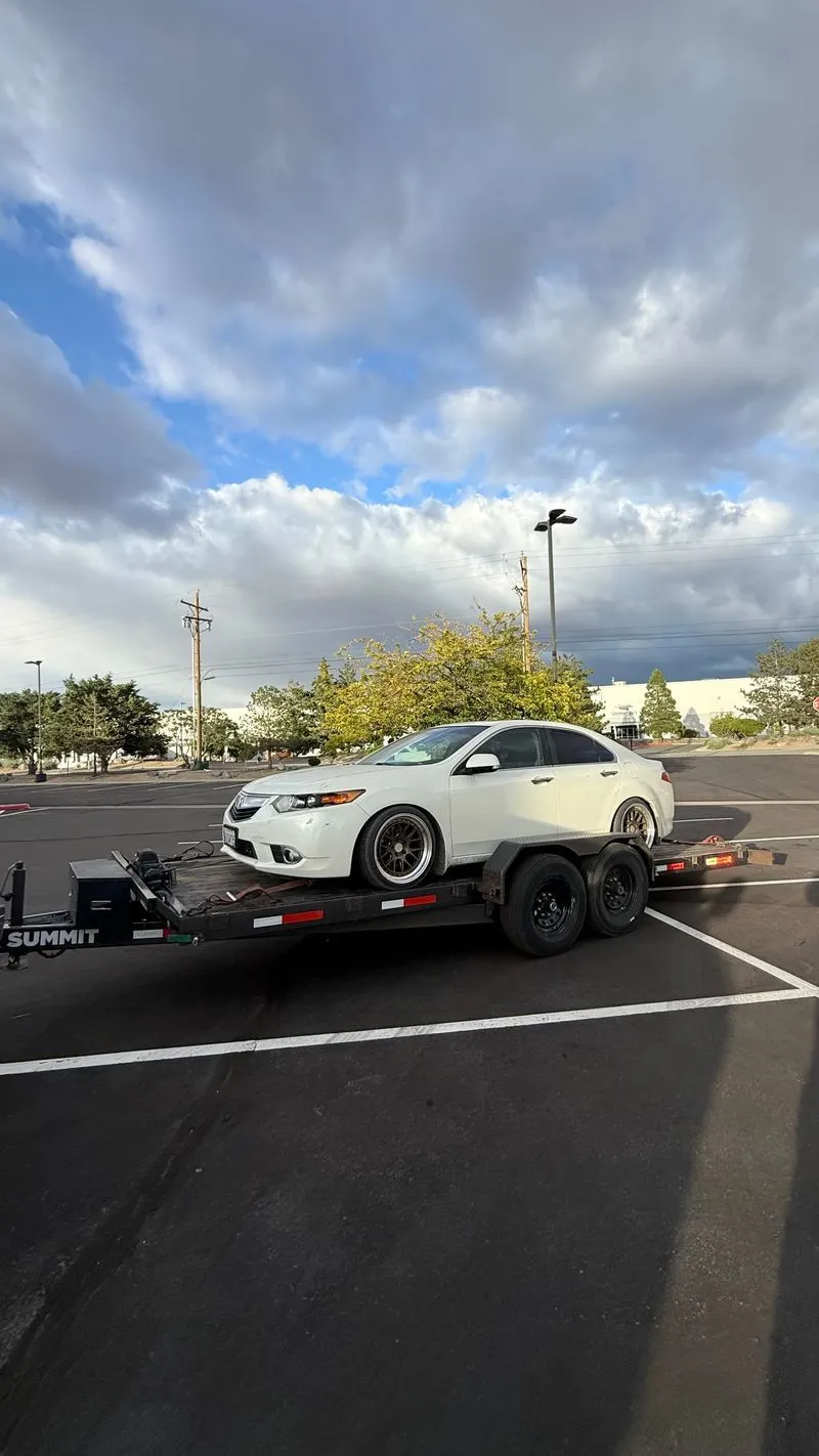 White Acura TSX on an OTG Summit gravity tilt car hauler