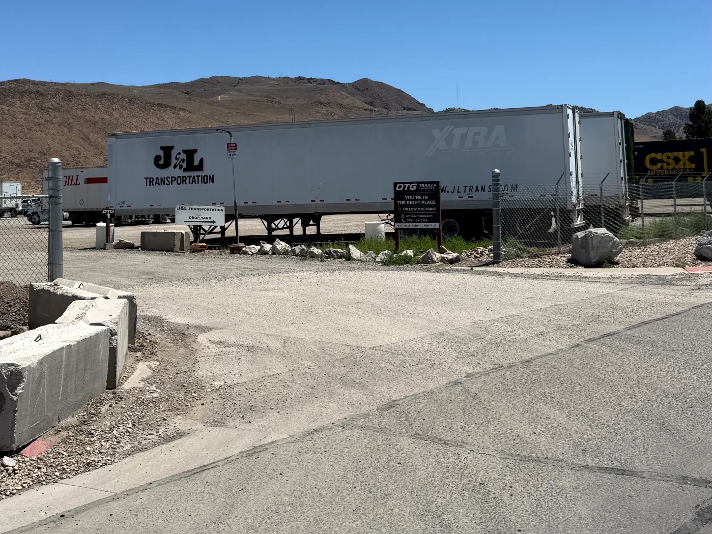 OTG yard entrance off Franklin Way in Sparks, with the black OTG sign next to the J&L Transportation drop yard sign