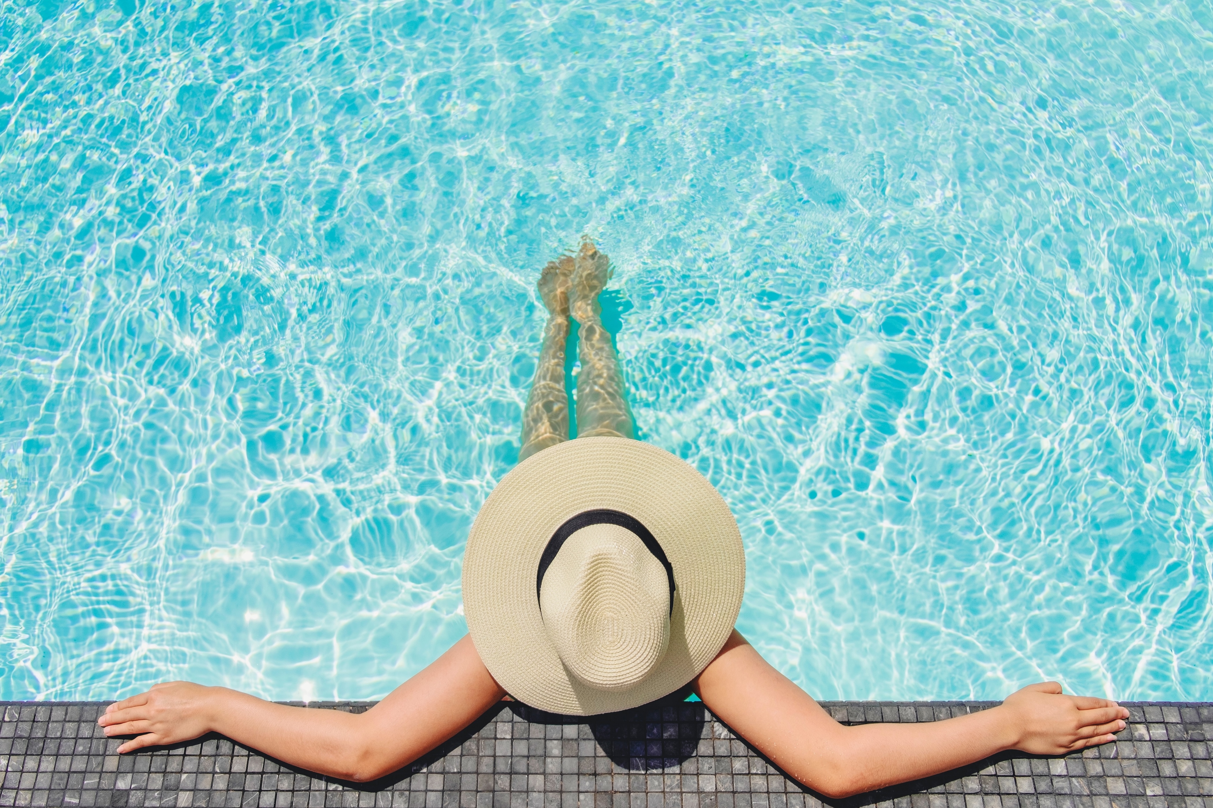 Woman in pool stock photo