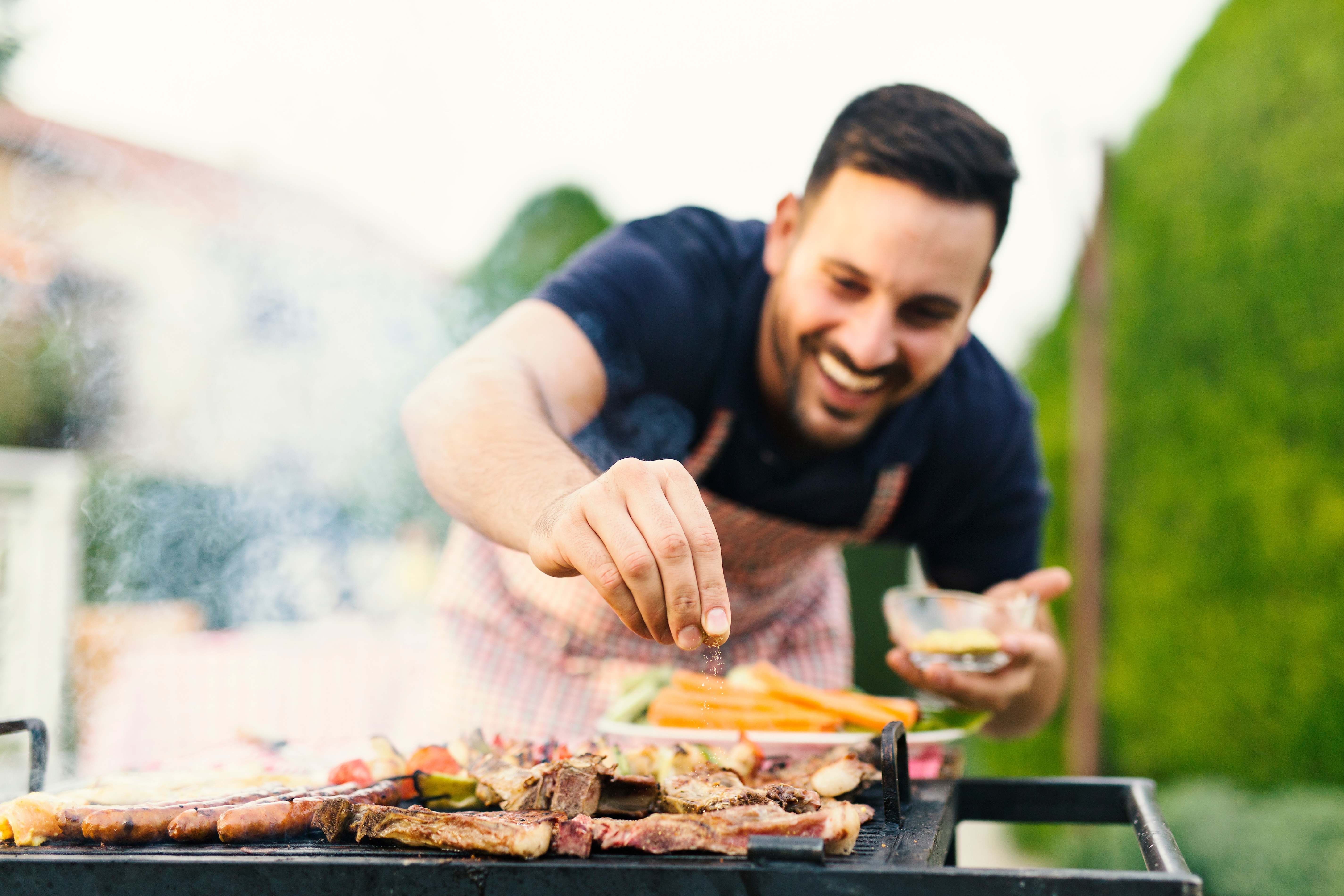 Man barbecuing stock photo