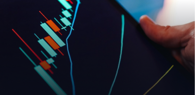 Tablet screen showing a candlestick chart with an upward trend line in a trading setup.