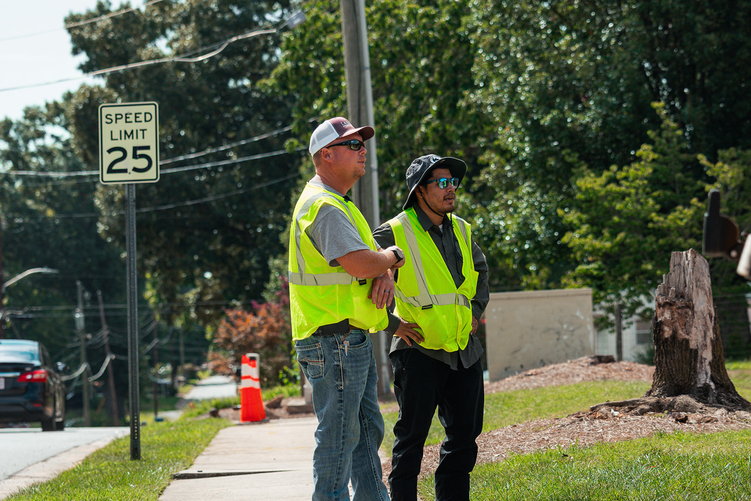 Jazz Ortiz meeting with Jordan Lambeth on a construction site overseeing video production operations and strategizing.