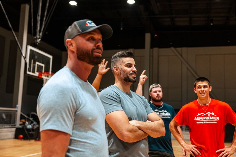 A&M Premier Roofing team members at a wrestling event