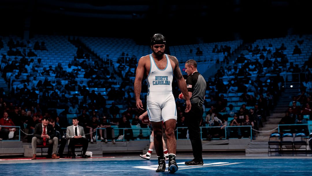 UNC wrestler competing during a collegiate wrestling match