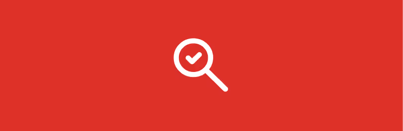 White magnifying glass icon with check mark inside on a red background.