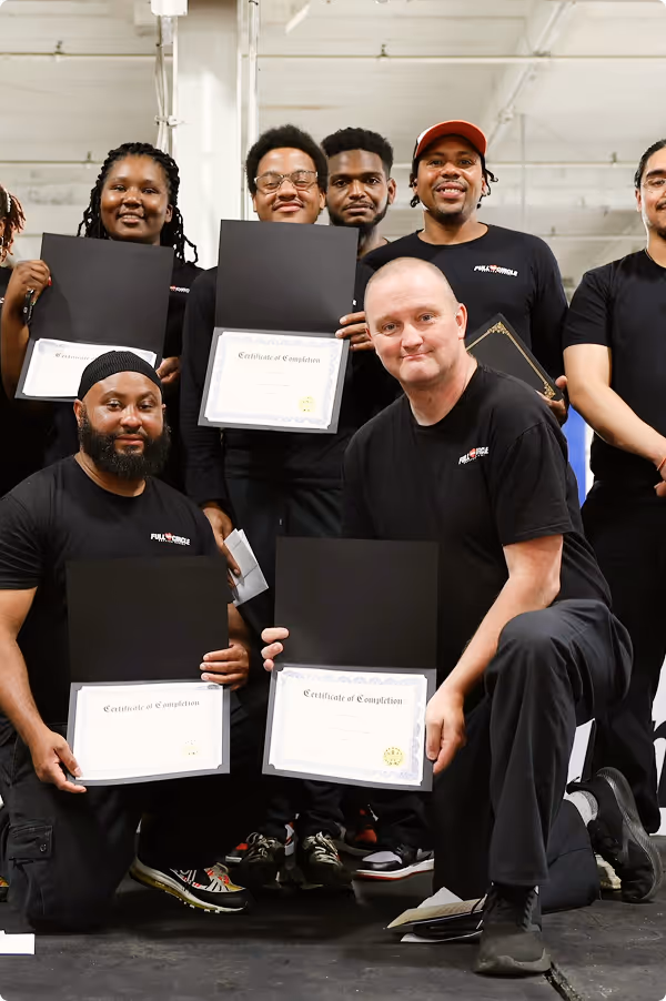 Vehicles for Change trainees showing certificates of completion